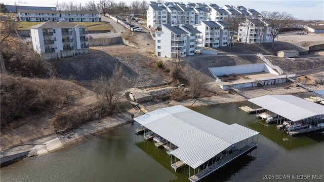 bird's eye view of apartment complex and a nearby body of water