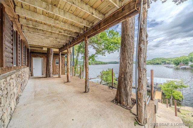 view of patio with a water view
