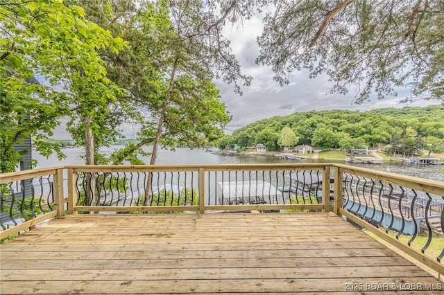 wooden deck featuring a water view