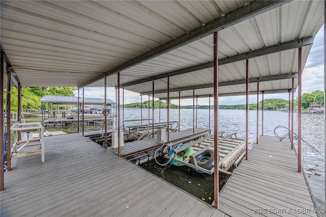dock area featuring a water view and boat lift
