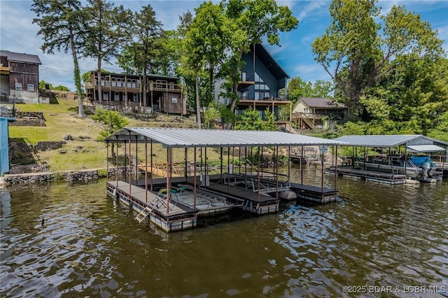 dock area with a water view and boat lift