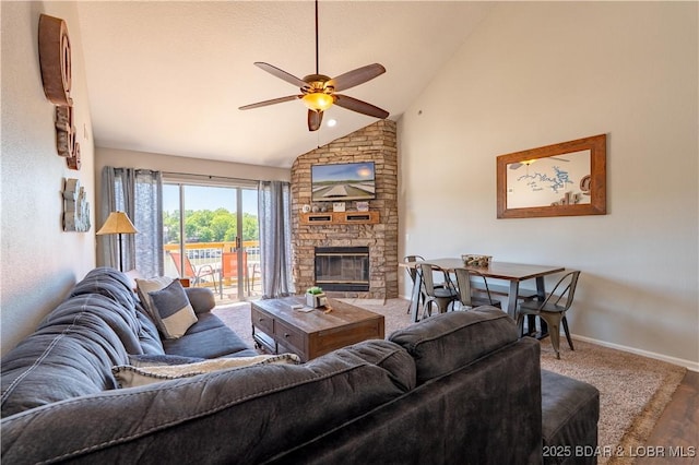 1481 Ledges Dr Unit 641, Osage Beach, MO 65065 - living area featuring ceiling fan, a fireplace, wood finished floors, baseboards, and high vaulted ceiling