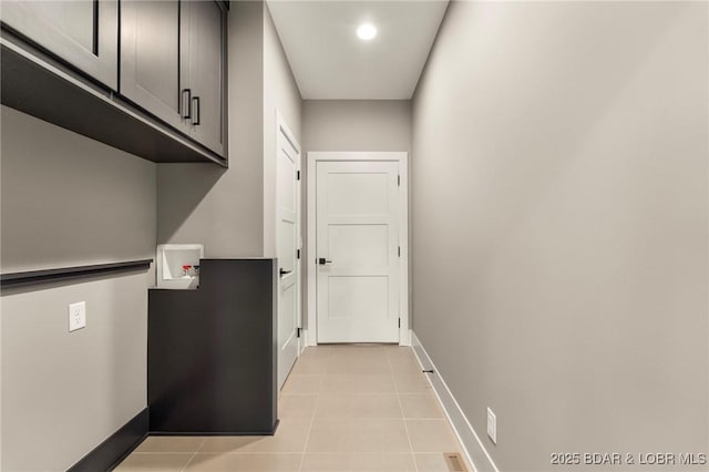 doorway to outside with baseboards, light tile patterned floors, and recessed lighting