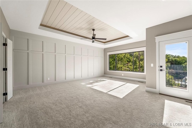 61 Eagle Crest Rd, Lake Ozark, MO 65049 - carpeted spare room featuring a tray ceiling, ceiling fan, and wood ceiling