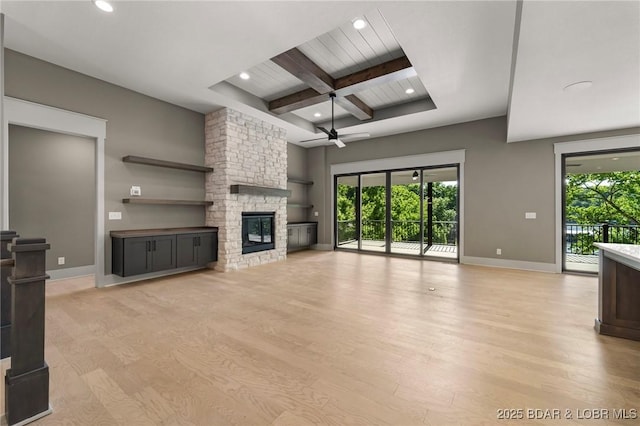 unfurnished living room with ceiling fan, beam ceiling, baseboards, recessed lighting, and light wood finished floors