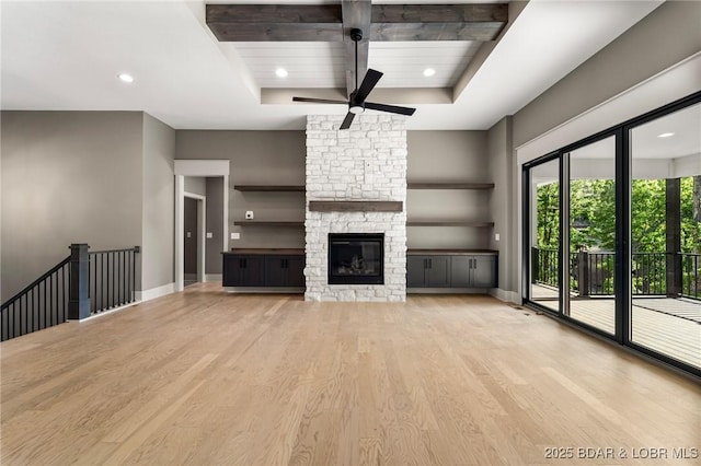 unfurnished living room featuring wood finished floors, a ceiling fan, recessed lighting, a fireplace, and baseboards