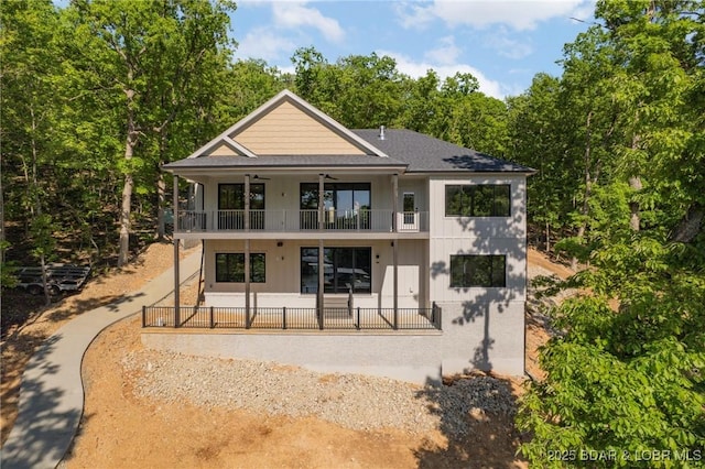 rear view of house with a balcony and a patio area