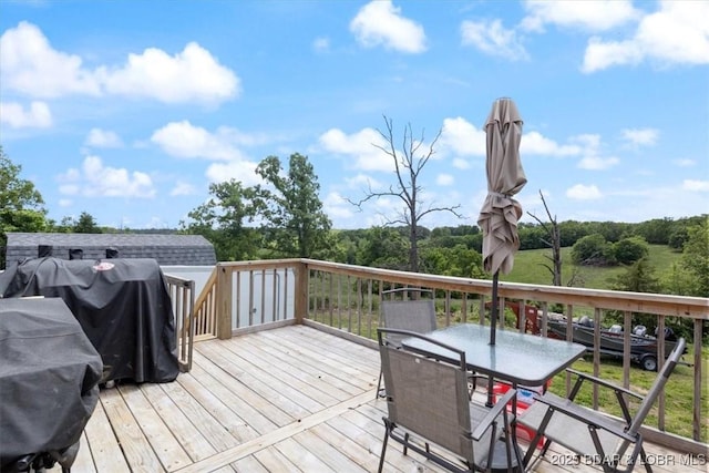 deck featuring outdoor dining area