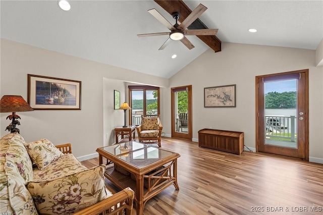 living room featuring light wood-style flooring, a ceiling fan, baseboards, and recessed lighting