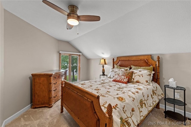 bedroom featuring light carpet, vaulted ceiling, baseboards, and a ceiling fan