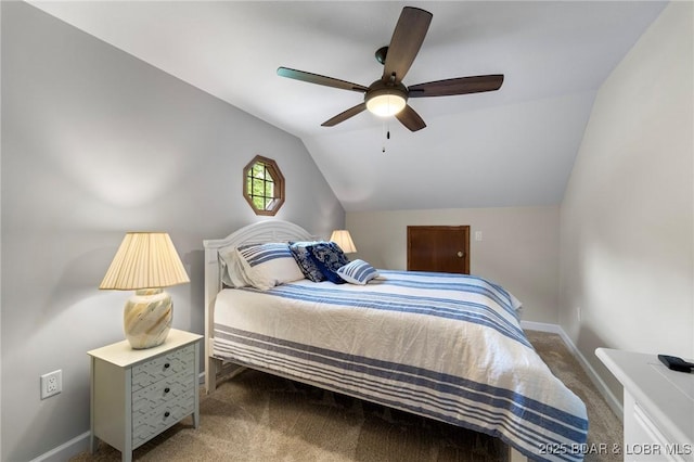 carpeted bedroom featuring vaulted ceiling, baseboards, and a ceiling fan