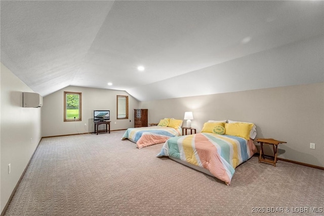 bedroom featuring vaulted ceiling, carpet floors, baseboards, and a wall mounted AC