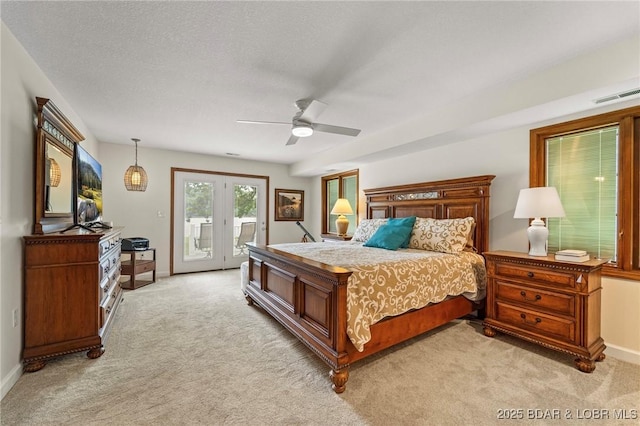 bedroom featuring access to exterior, light colored carpet, french doors, baseboards, and a textured ceiling