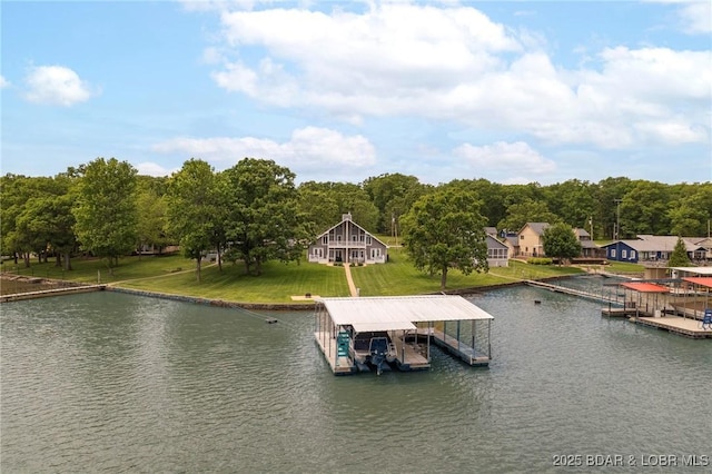 dock area featuring boat lift and a water view
