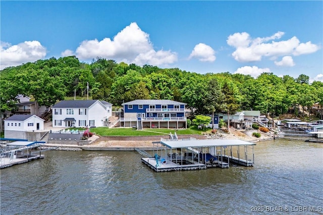 dock featuring stairway and a deck with water view