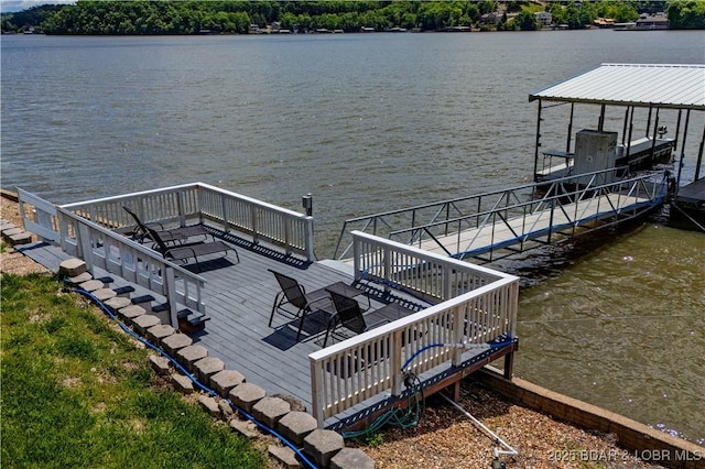 dock featuring a water view, boat lift, and stairs