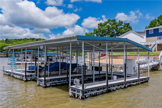 dock with boat lift and a water view