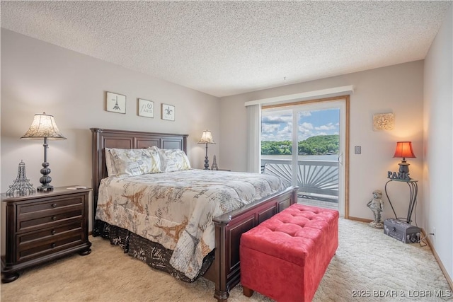 carpeted bedroom with access to outside, a textured ceiling, and baseboards
