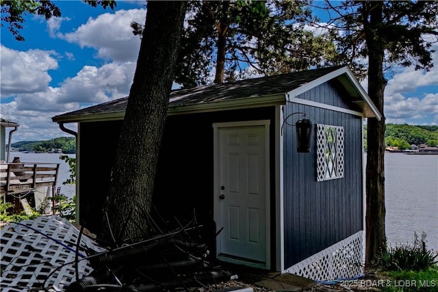 view of outbuilding featuring an outbuilding and a water view