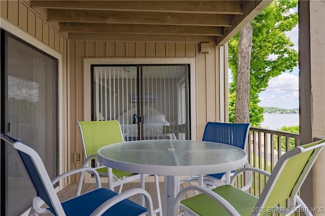 view of patio / terrace featuring a water view and outdoor dining area