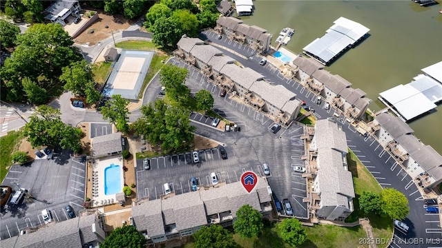 view of property location featuring a pool area and a large body of water