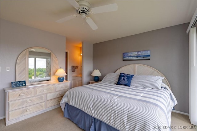 bedroom featuring light colored carpet and a ceiling fan
