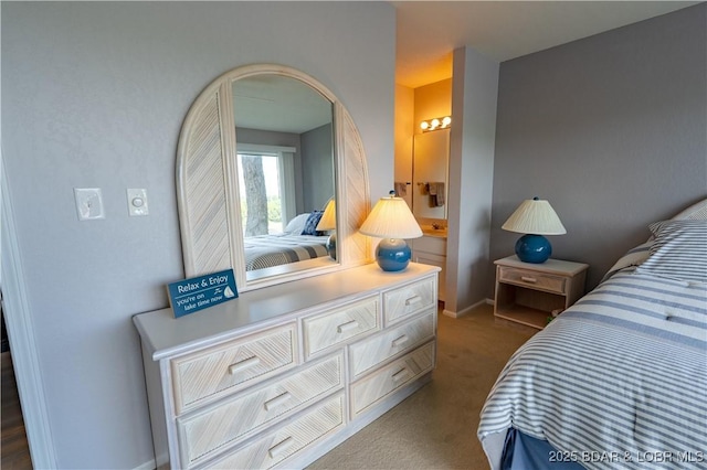 bedroom with carpet floors, arched walkways, and baseboards