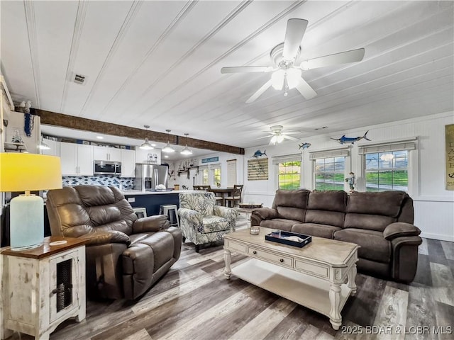 living room featuring wood finished floors and ceiling fan