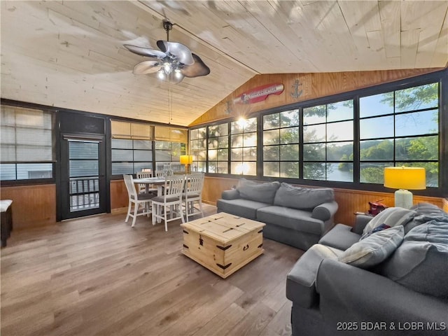sunroom / solarium featuring lofted ceiling