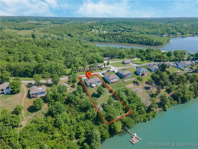 22714 Lake Ridge Dr, Warsaw, MO 65355 - view of property location with a forest, a large body of water, and property parcel outlined
