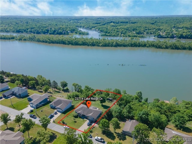 22714 Lake Ridge Dr, Warsaw, MO 65355 - view of property location featuring a heavily wooded area, property boundaries highlighted, and a nearby body of water
