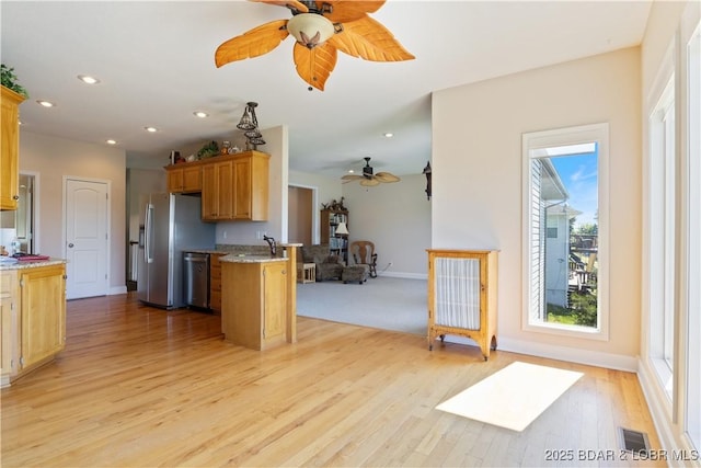 22714 Lake Ridge Dr, Warsaw, MO 65355 - kitchen featuring a ceiling fan, stainless steel appliances, light wood-style flooring, recessed lighting, and baseboards