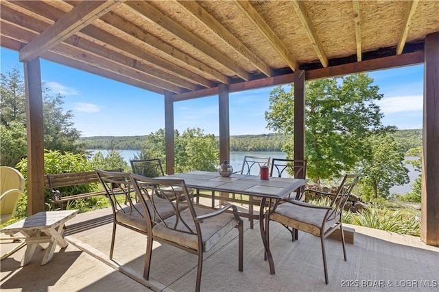22714 Lake Ridge Dr, Warsaw, MO 65355 - view of patio with a water view and outdoor dining area