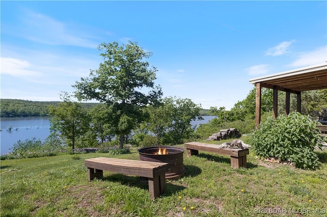 22714 Lake Ridge Dr, Warsaw, MO 65355 - view of yard featuring an outdoor fire pit and a water view