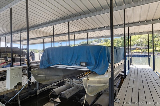 22714 Lake Ridge Dr, Warsaw, MO 65355 - dock area with boat lift and a water view
