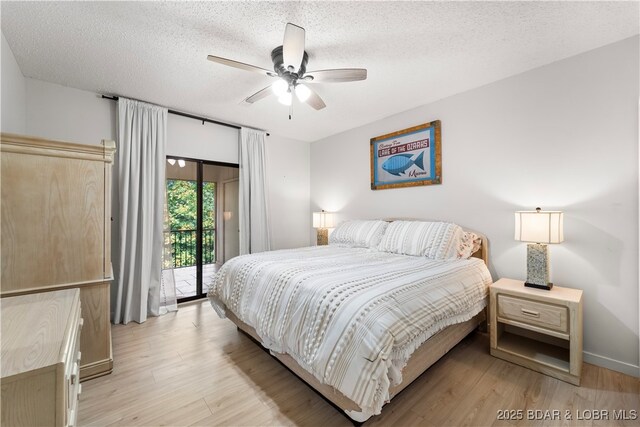 bedroom featuring access to outside, light wood-style flooring, a textured ceiling, and ceiling fan