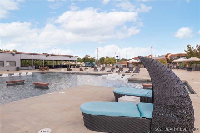 community pool with a patio area