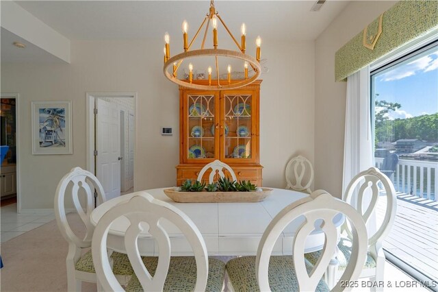 dining space featuring a chandelier