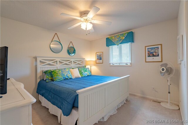 bedroom with carpet floors, a ceiling fan, and baseboards