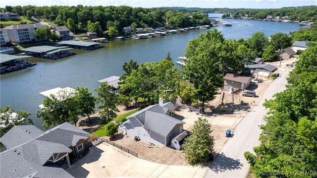 aerial view of residential area featuring a nearby body of water
