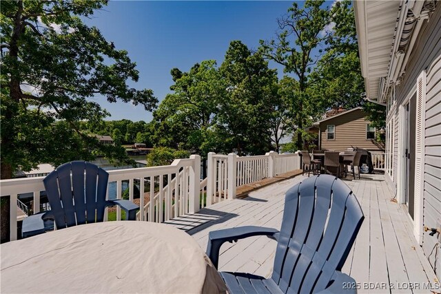 deck featuring outdoor dining area