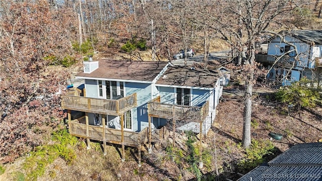 279 Spring Rd, Lake Ozark, MO 65049 - view of property exterior with a balcony and a chimney