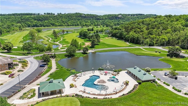 aerial view of a nearby body of water, a pool area, and a golf club