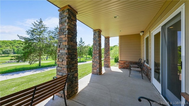 porch with a yard