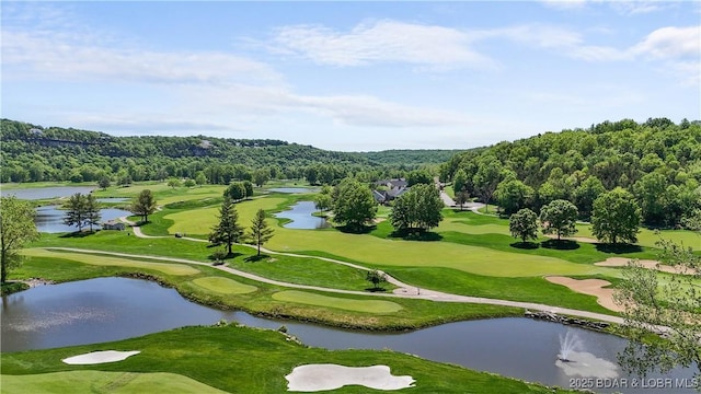 surrounding community featuring a water view and golf course view
