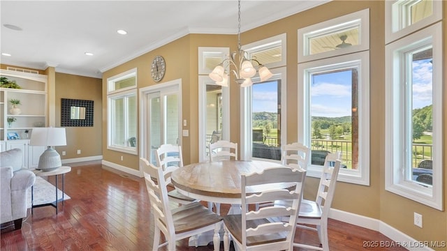 dining space featuring dark wood-style floors, baseboards, a chandelier, crown molding, and recessed lighting
