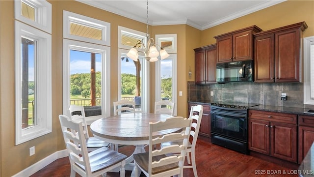 kitchen featuring black appliances, a chandelier, backsplash, dark wood-type flooring, and decorative light fixtures