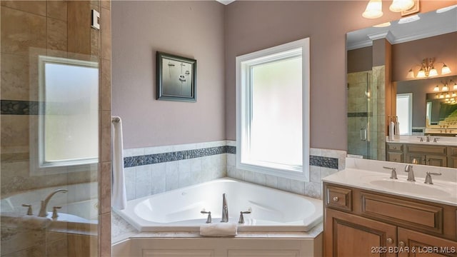 full bath with a shower stall, a bath, and two vanities