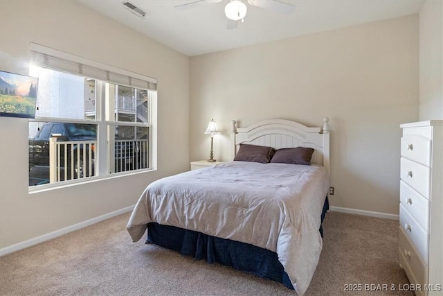 bedroom with carpet floors, baseboards, and a ceiling fan