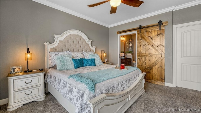carpeted bedroom with crown molding, a barn door, baseboards, ceiling fan, and ensuite bathroom